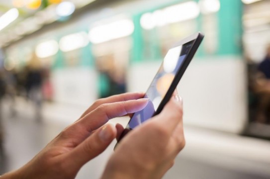 Woman-Using-Her-Cell-Phone-Subway